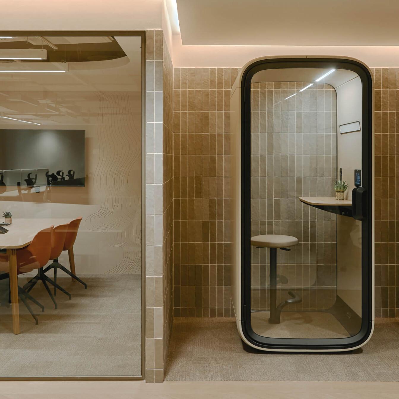 Framery One Compact in a sand-toned office