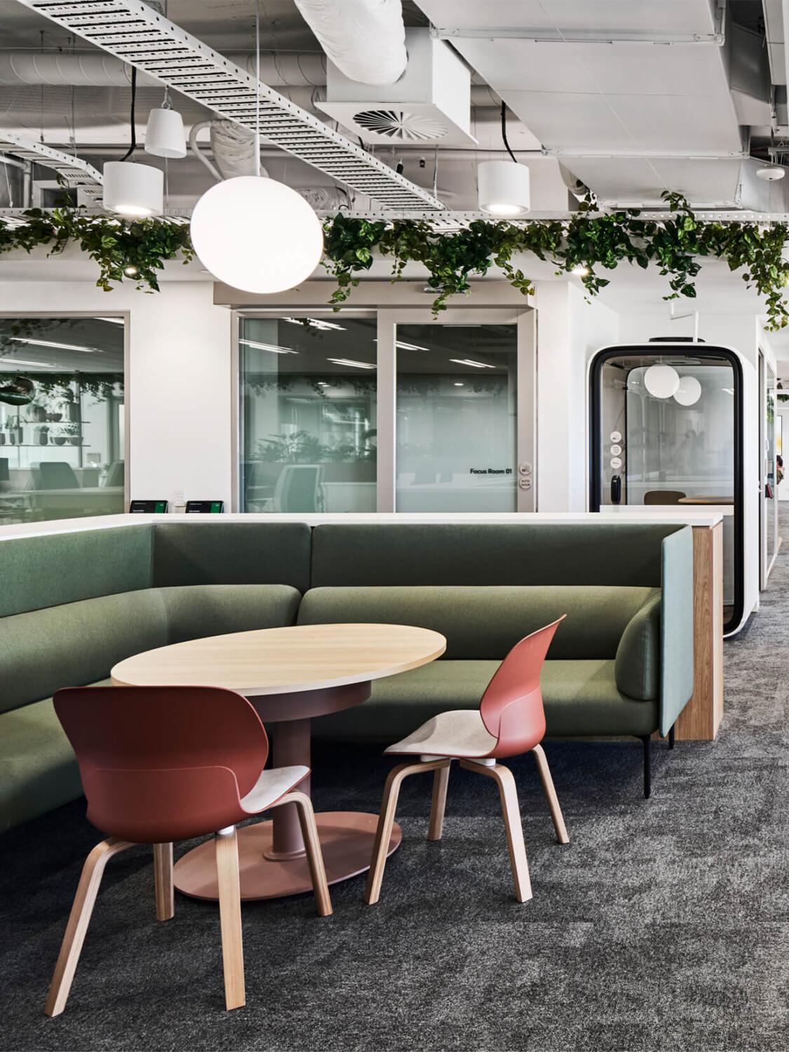 A lounge setting with an office in the back.