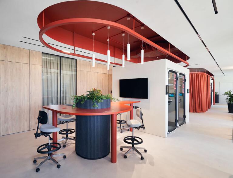 Framery One Compact office pods in a red and white office setting