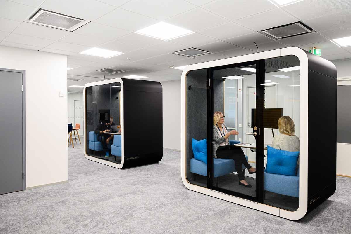 People Working in Black Framery Q Office Pod