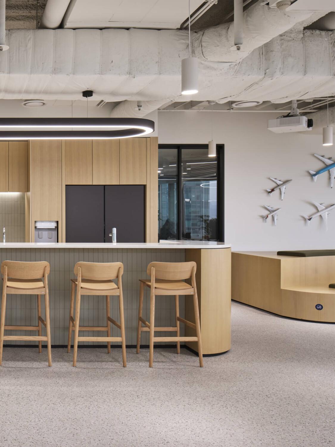 A light wood colored office kitchen