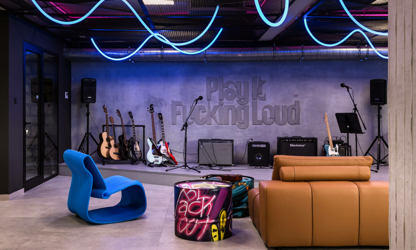 A modern punk-style stage and lounge.