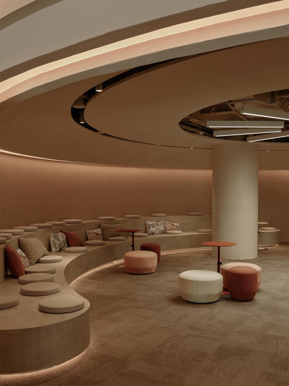 A light toned and dark, modern meeting area in an office.
