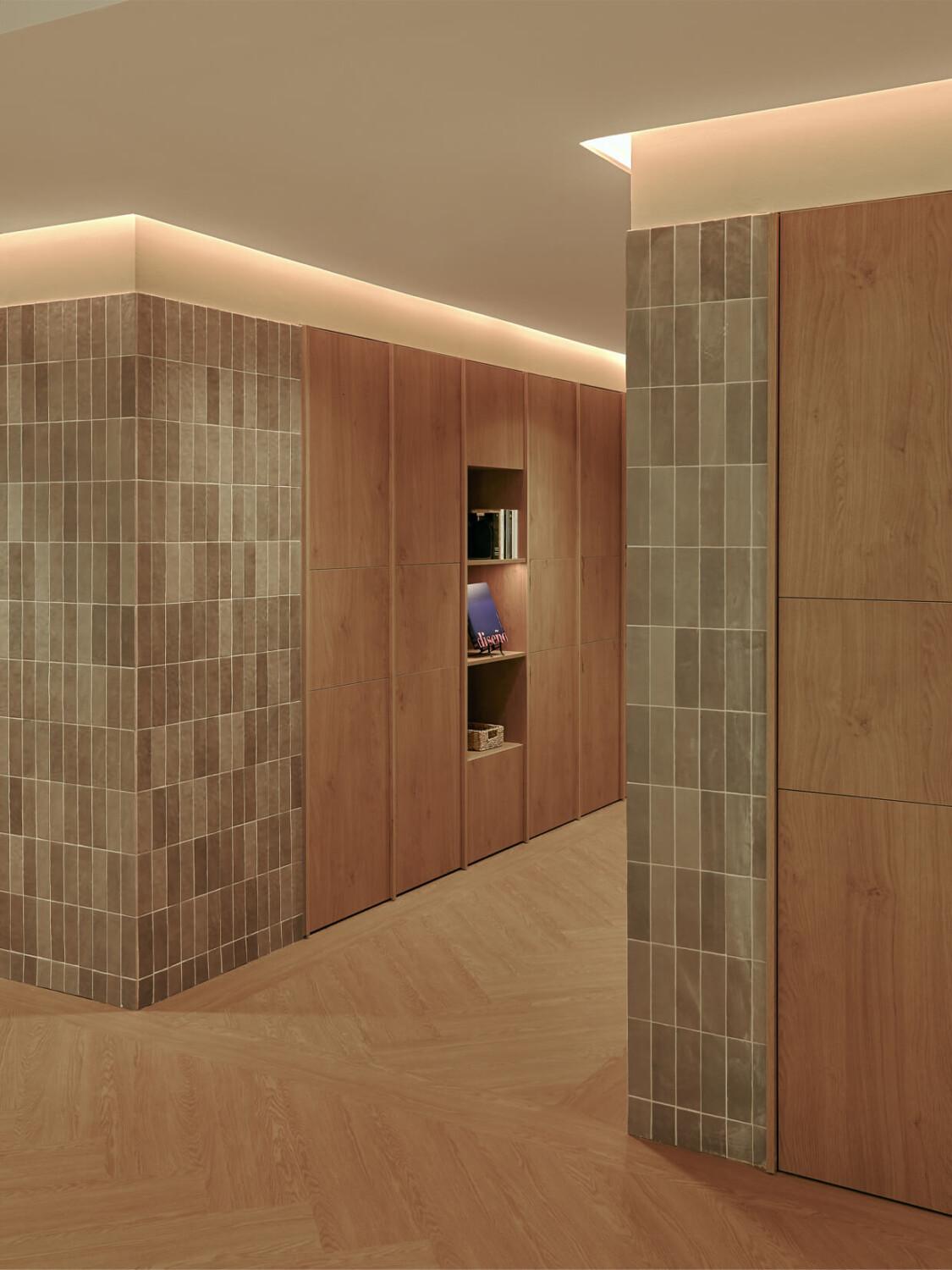 An office hallway with beautiful stone and wooden crafted walls.