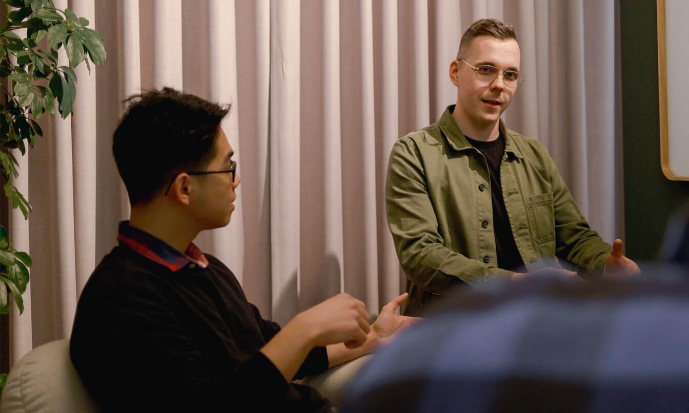 Two men talking in an office