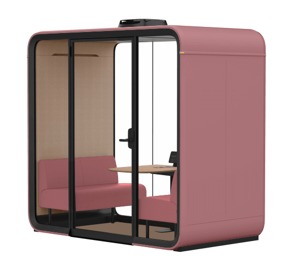 Modern, pink office booth with glass doors, seating, and a wooden table inside. Designed for private work or meetings in open spaces.