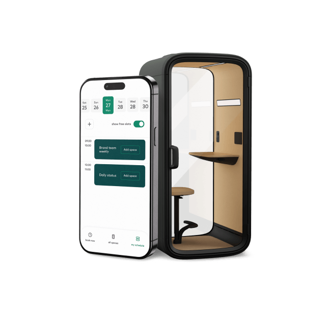 A phone showing Framery App next to a Framery One Compact smart office phone booth